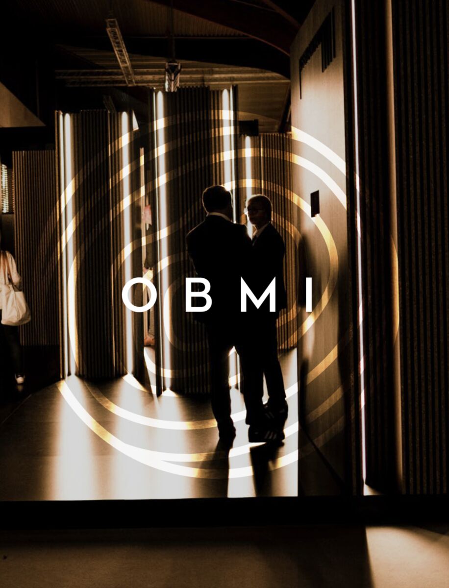Two figures in a lit OBMI entrance hall